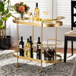 Kamal Glam Brushed Metal And Mirrored Glass 2 Tier Mobile Wine Bar Cart Gold - Baxton Studio -Outlet Baxton Studio Store GUEST 034e04a5 db63 474b 9d05 6c159816da1c